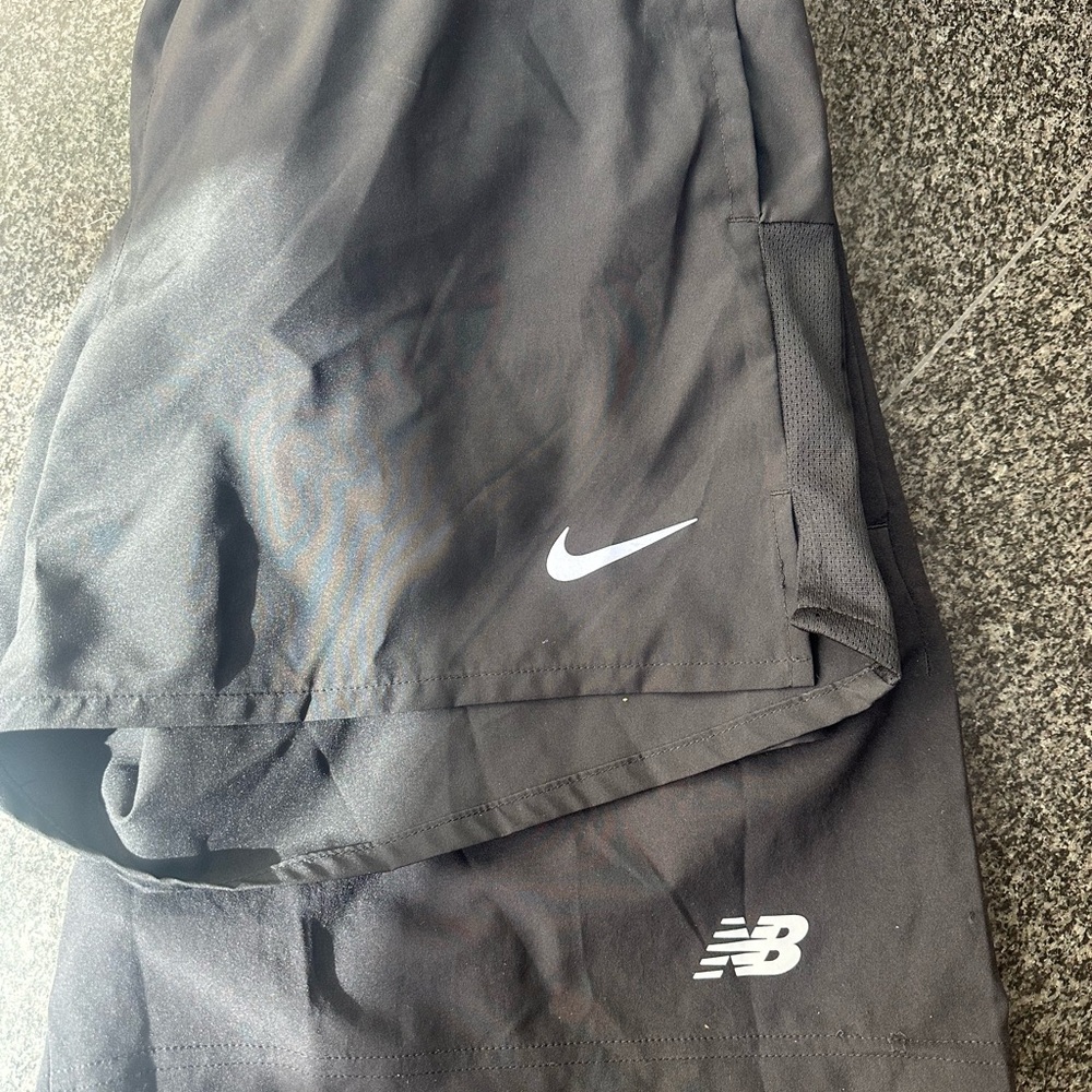 Lot of two men’s running shorts Nike and NB
